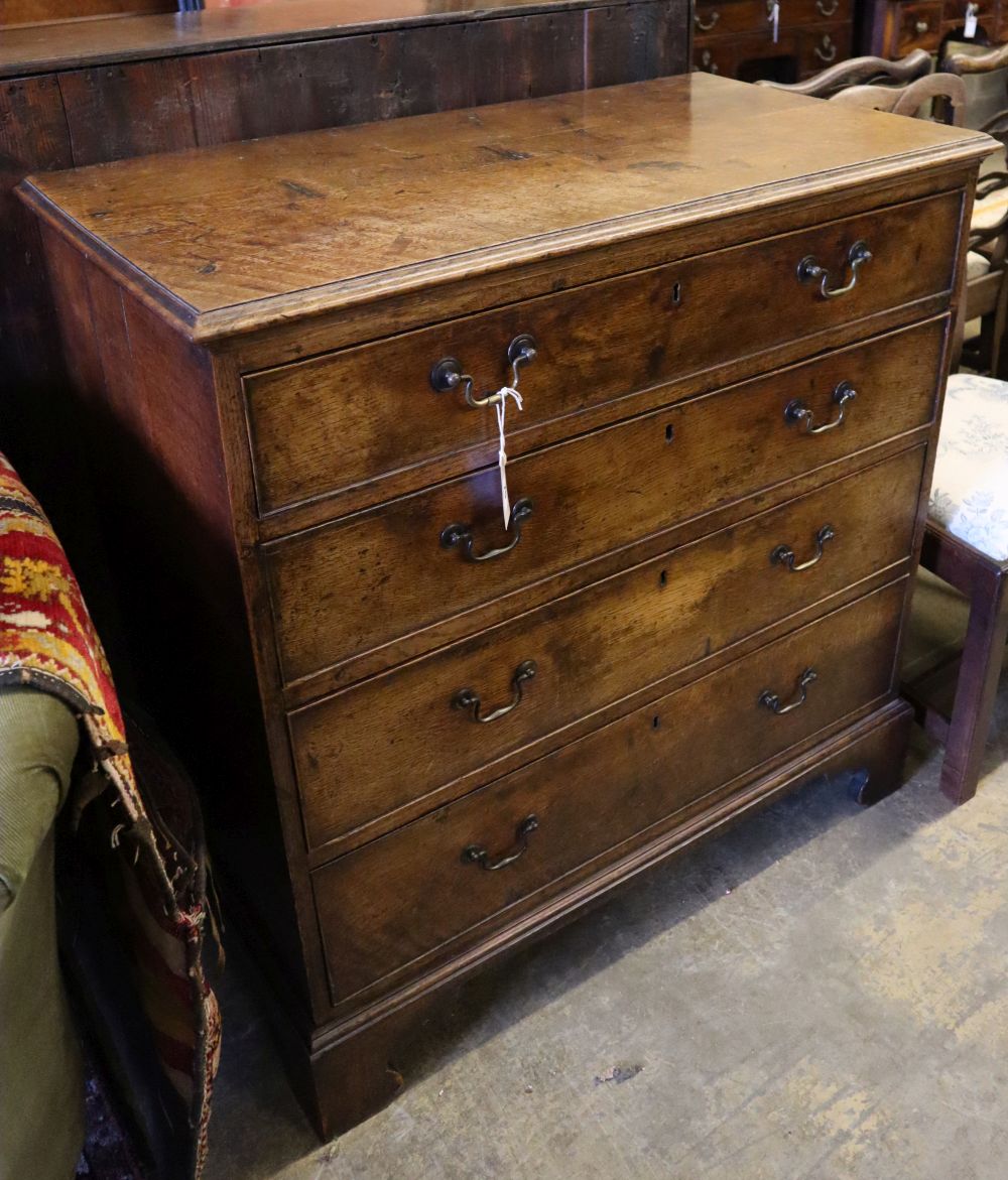 An 18th century oak chest fitted four graduated long drawers on shaped bracket feet, width 97cm depth 50cm height 96cm